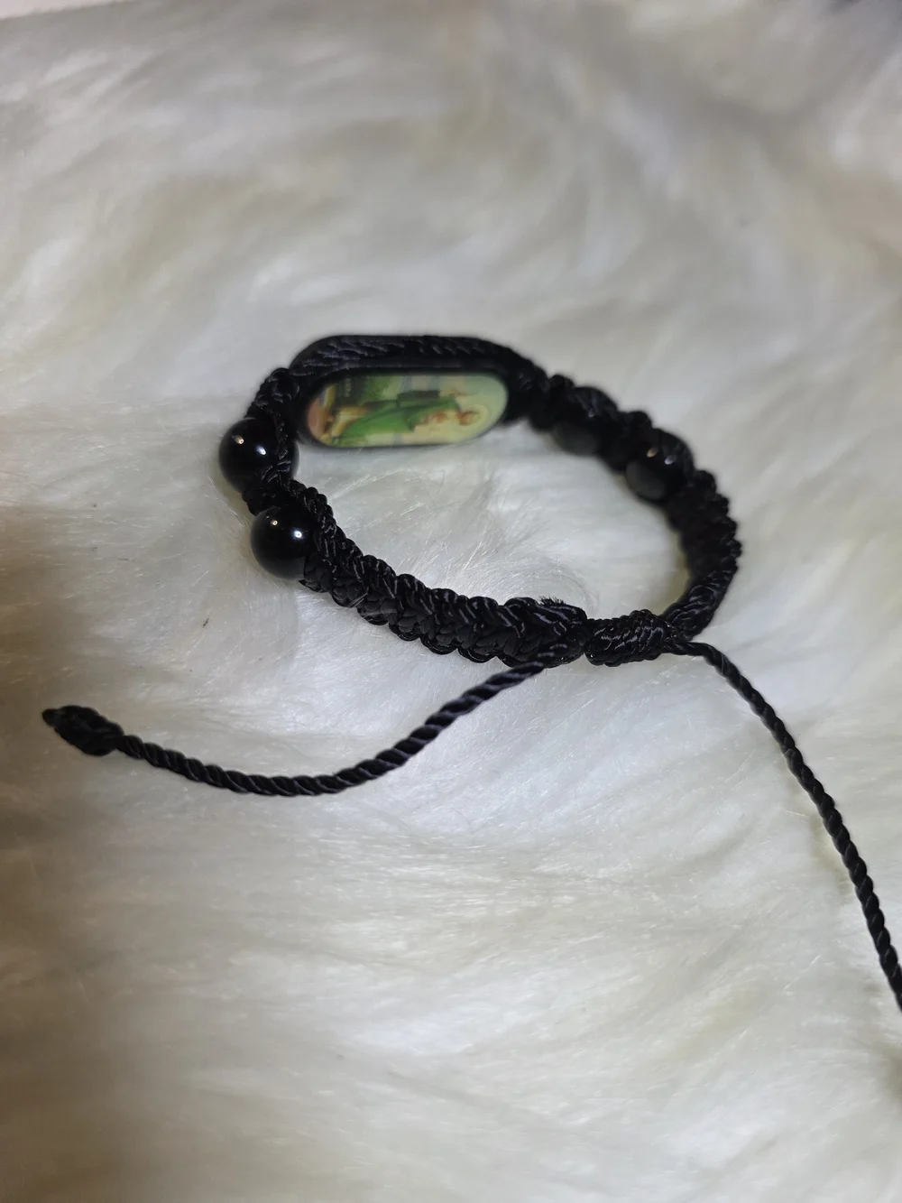 Black Cord Religious Bracelet with Green Saint Image